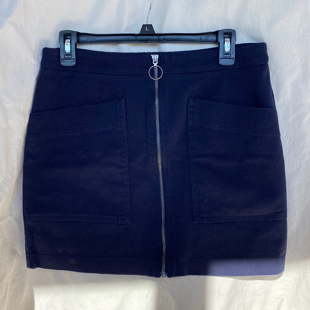 Navy denim mini skirt with full zipper and deep front pockets